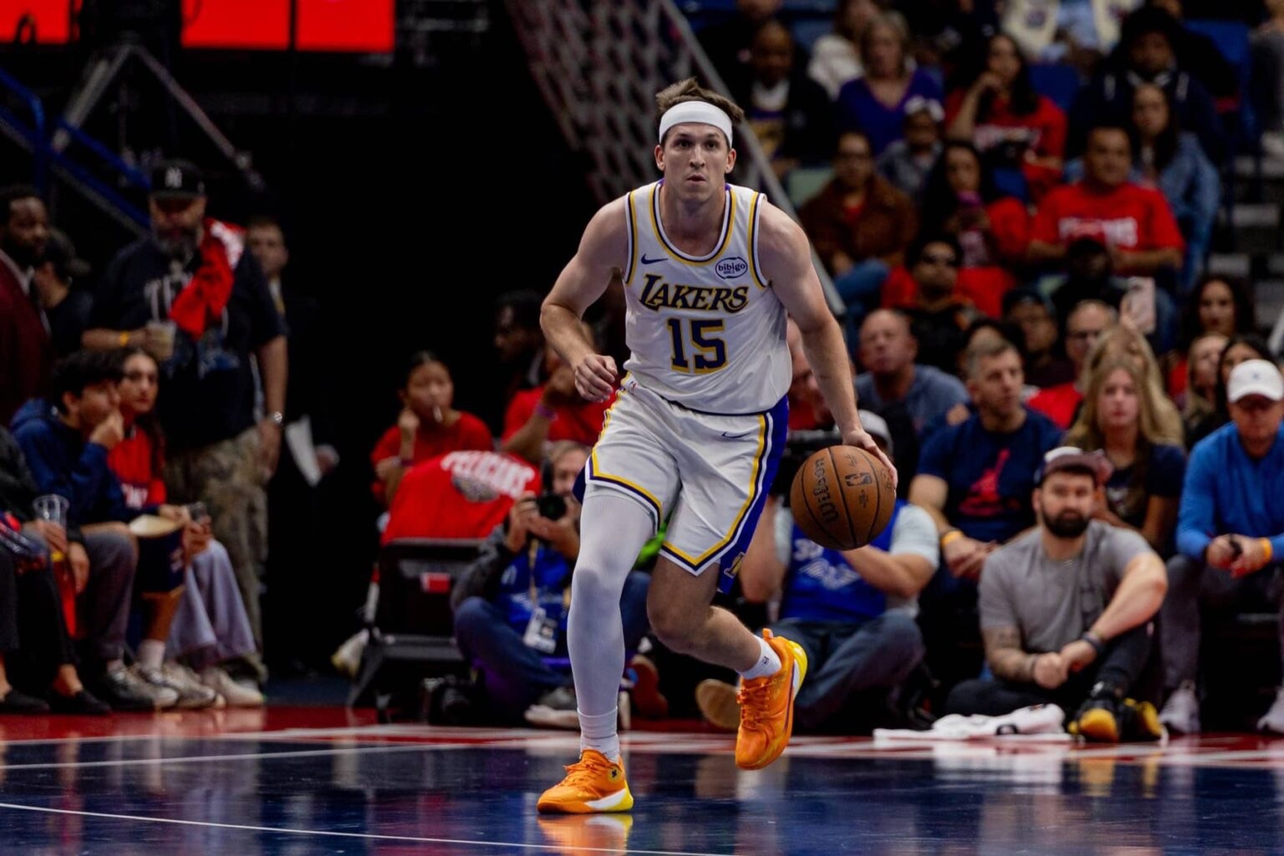 Nov 14, 2025; New Orleans, Louisiana, USA; Los Angeles Lakers guard Austin Reaves (15) brings the ball up court against the New Orleans Pelicans during the first half at Smoothie King Center. Mandatory Credit: Stephen Lew-Imagn Images