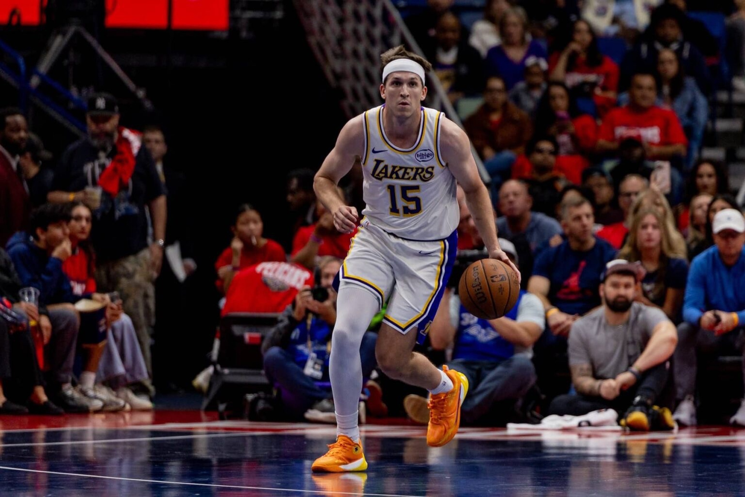 Nov 14, 2025; New Orleans, Louisiana, USA; Los Angeles Lakers guard Austin Reaves (15) brings the ball up court against the New Orleans Pelicans during the first half at Smoothie King Center. Mandatory Credit: Stephen Lew-Imagn Images