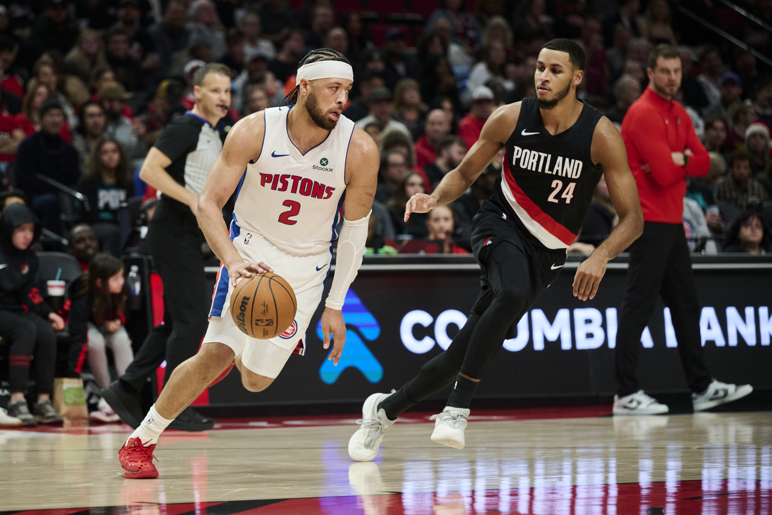 Dec 22, 2025; Portland, Oregon, USA; Detroit Pistons guard Cade Cunningham (2) dribbles the ball during the first half against Portland Trail Blazers forward Kris Murray (24) at Moda Center. Mandatory Credit: Troy Wayrynen-Imagn Images
