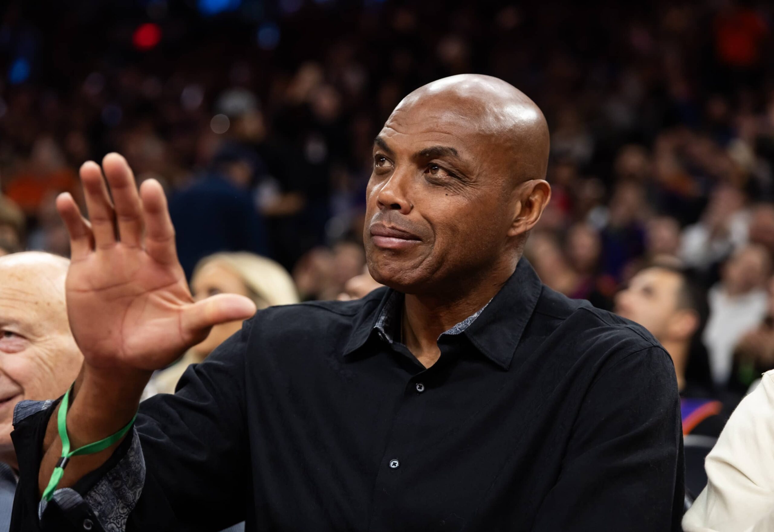 Phoenix Suns former player Charles Barkley sits courtside against the Minnesota Timberwolves during an NBA Cup game at Mortgage Matchup Center.