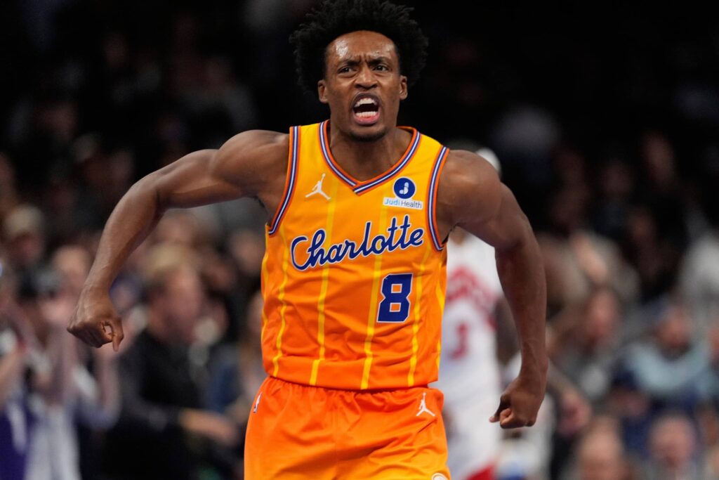 Charlotte Hornets guard Collin Sexton (8) reacts after defeating the Toronto Raptors in overtime at Spectrum Center.