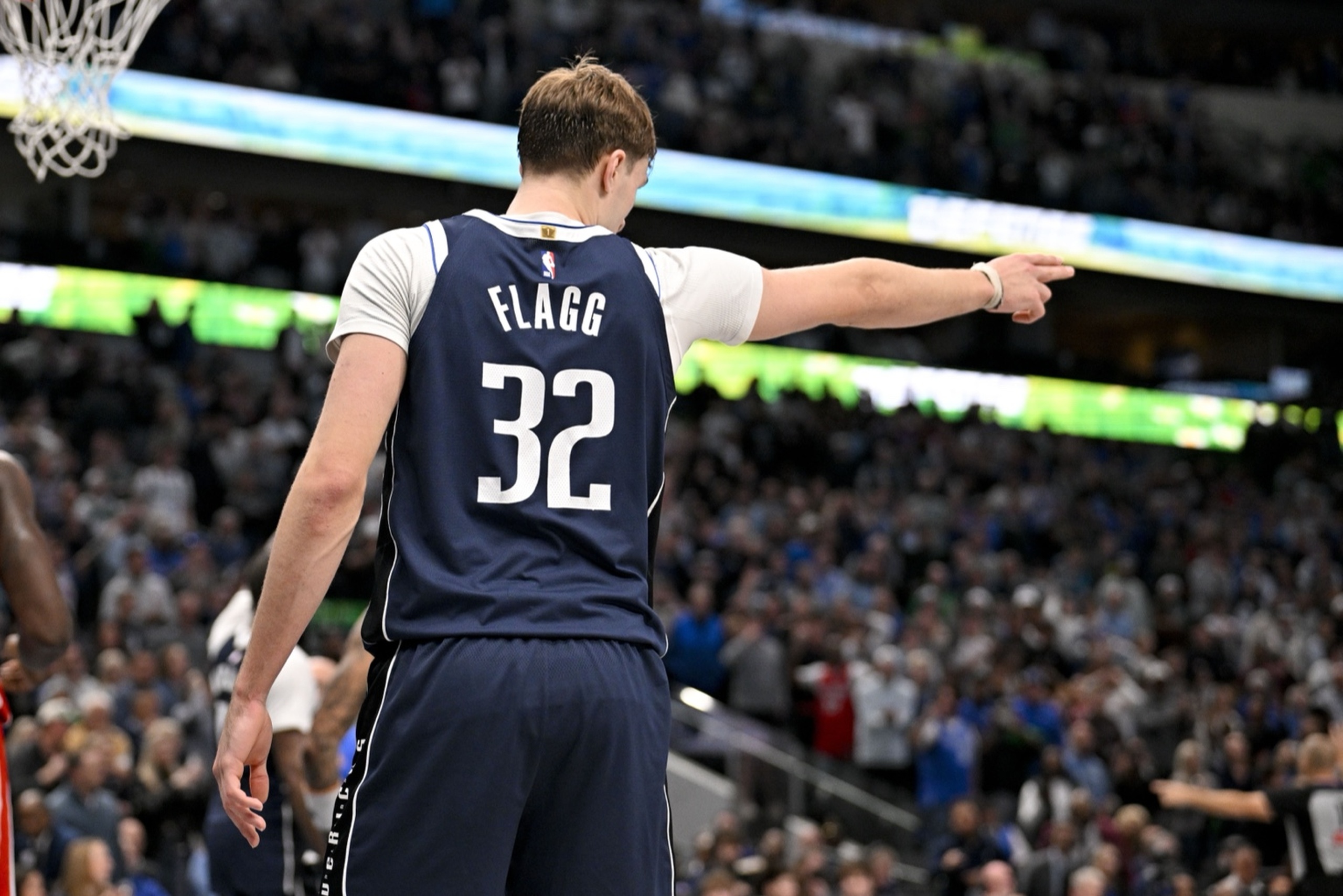Dec 18, 2025; Dallas, Texas, USA; Dallas Mavericks forward Cooper Flagg (32) motions for Dallas possession during overtime against the Detroit Pistons at the American Airlines Center. Mandatory Credit: Jerome Miron-Imagn Images