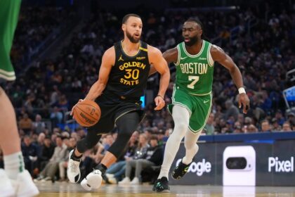 San Francisco, California, USA; Golden State Warriors guard Stephen Curry (30) dribbles past Boston Celtics forward Jaylen Brown (7) in the third quarter at the Chase Center. Mandatory Credit: Cary Edmondson-Imagn Images