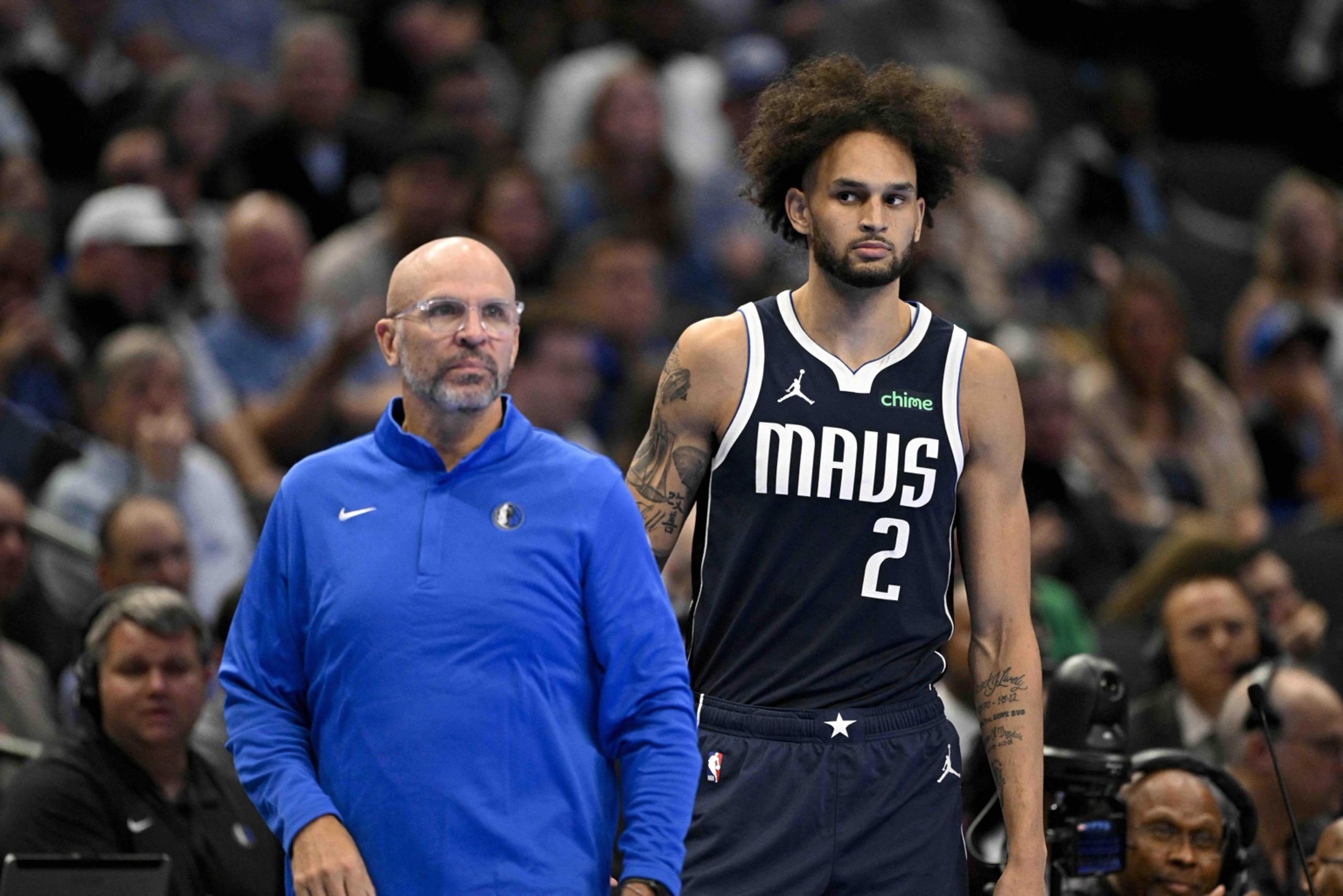 Nov 14, 2025; Dallas, Texas, USA; Dallas Mavericks head coach Jason Kidd and center Dereck Lively II (2) look on during the second half against the LA Clippers in an NBA Cup game at the American Airlines Center. Mandatory Credit: Jerome Miron-Imagn Images