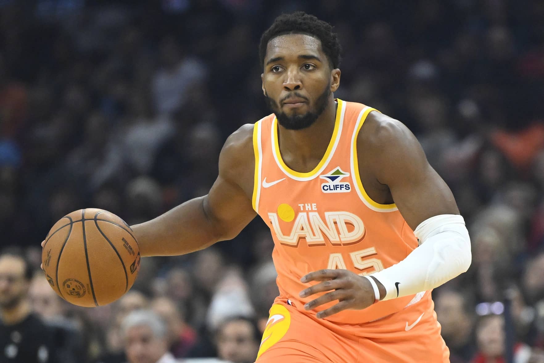 Dec 22, 2025; Cleveland, Ohio, USA; Cleveland Cavaliers guard Donovan Mitchell (45) brings the ball up court in the first quarter against the Charlotte Hornets at Rocket Arena. Mandatory Credit: David Richard-Imagn Images