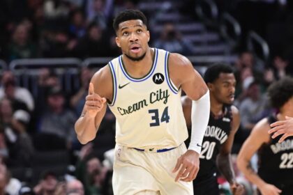 Nov 29, 2025; Milwaukee, Wisconsin, USA; Milwaukee Bucks forward Giannis Antetokounmpo (34) reacts after scoring his 21,000th career point in the third quarter against the Brooklyn Nets at Fiserv Forum. Mandatory Credit: Benny Sieu-Imagn Images