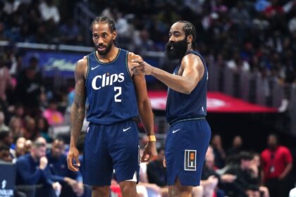 Nov 24, 2023; Los Angeles, California, USA; LA Clippers forward Kawhi Leonard (2) and guard James Harden (1) talk during their game against the New Orleans Pelicans in the second half at Crypto.com Arena. Mandatory Credit: Kirby Lee-Imagn Images