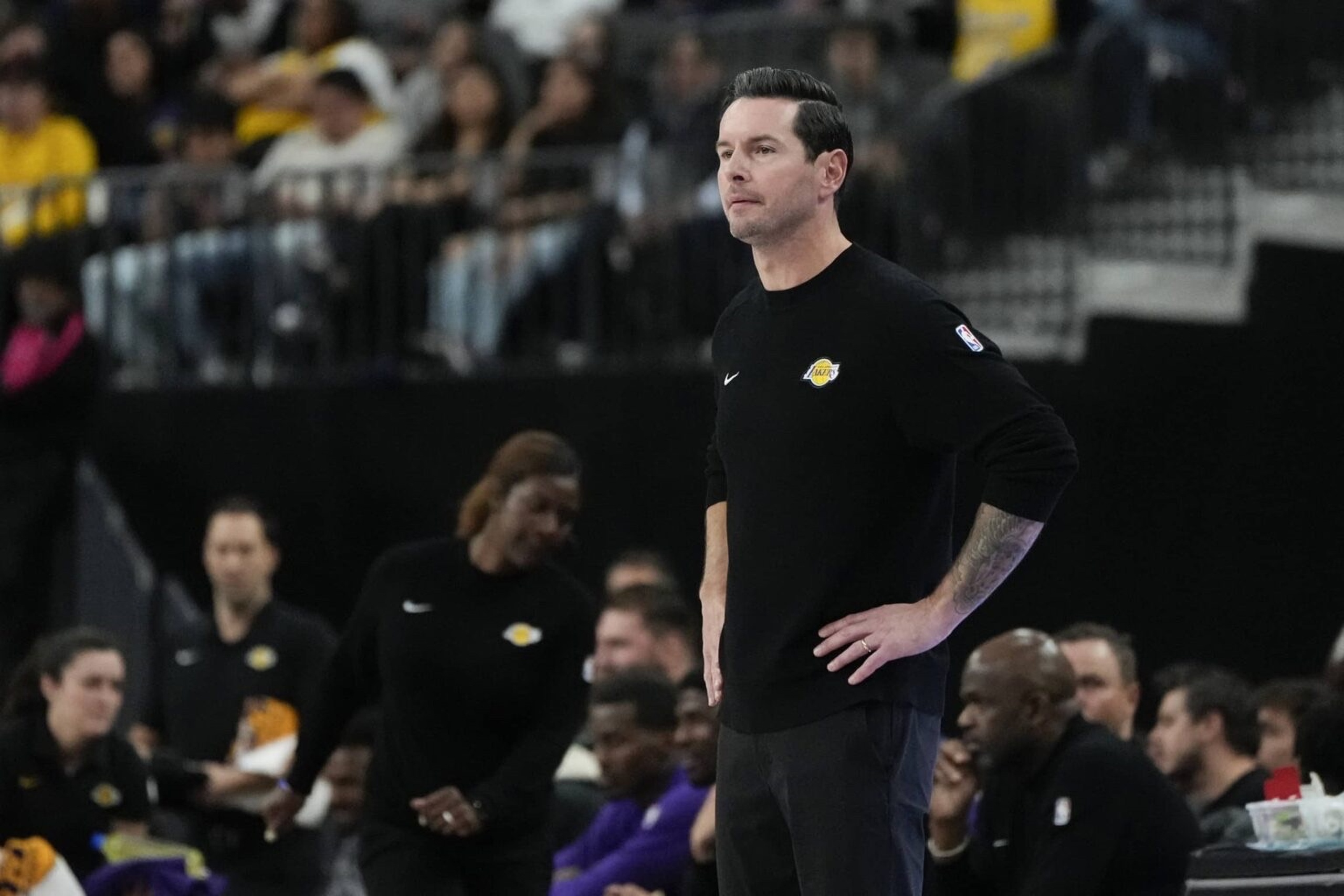 Oct 15, 2025; Las Vegas, Nevada, USA; Los Angeles Lakers head coach JJ Redick watches from the bench during the first half against the Dallas Mavericks at T-Mobile Arena. Mandatory Credit: Lucas Peltier-Imagn Images