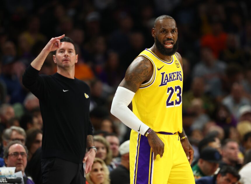 Dec 23, 2025; Phoenix, Arizona, USA; Los Angeles Lakers forward LeBron James (23) and head coach JJ Redick against the Phoenix Suns in the first half at Mortgage Matchup Center. Mandatory Credit: Mark J. Rebilas-Imagn Images