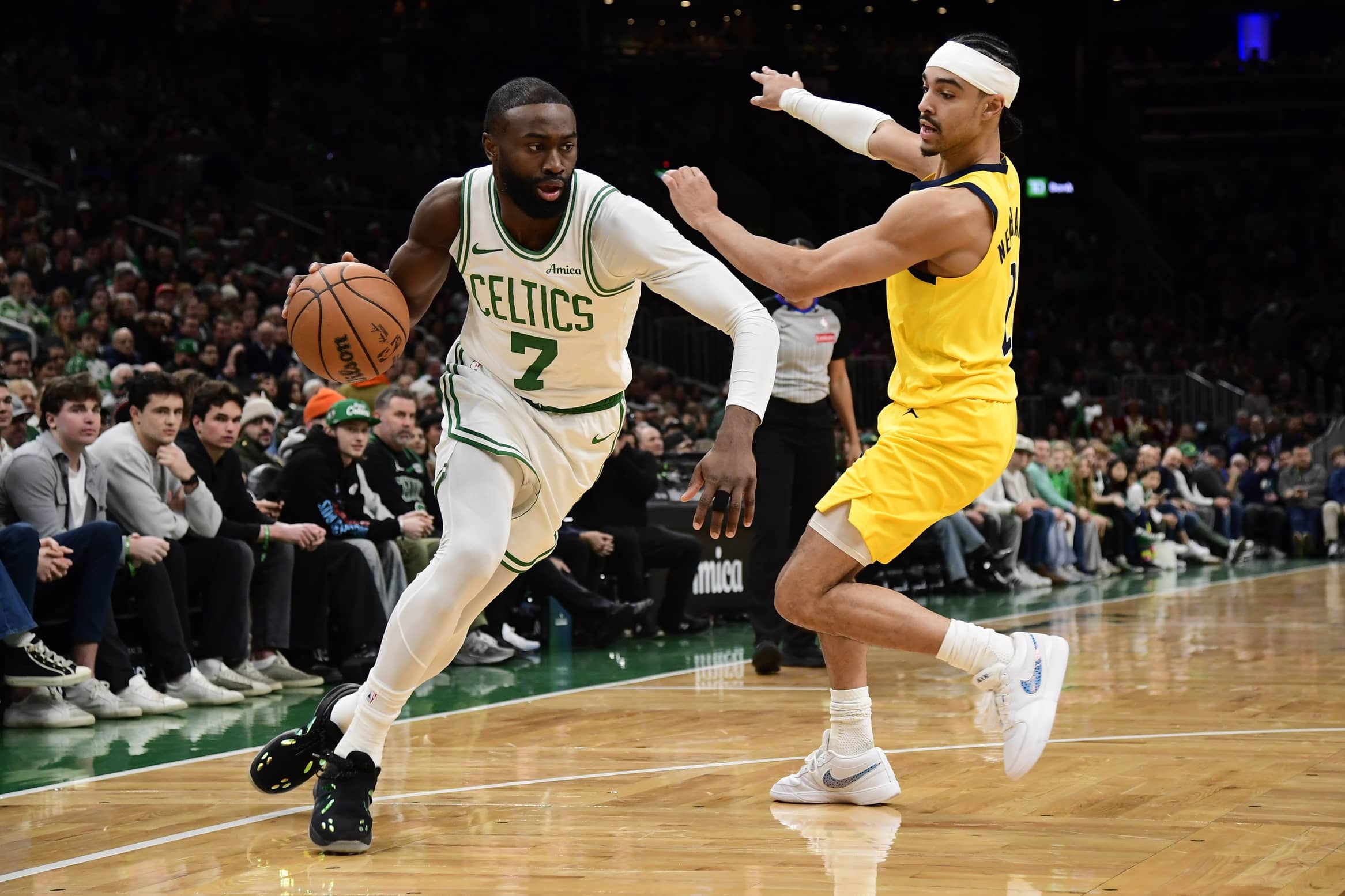 Dec 22, 2025; Boston, Massachusetts, USA; Boston Celtics guard Jaylen Brown (7) controls the ball while Indiana Pacers guard Andrew Nembhard (2) defends during the second half at TD Garden. Mandatory Credit: Bob DeChiara-Imagn Images