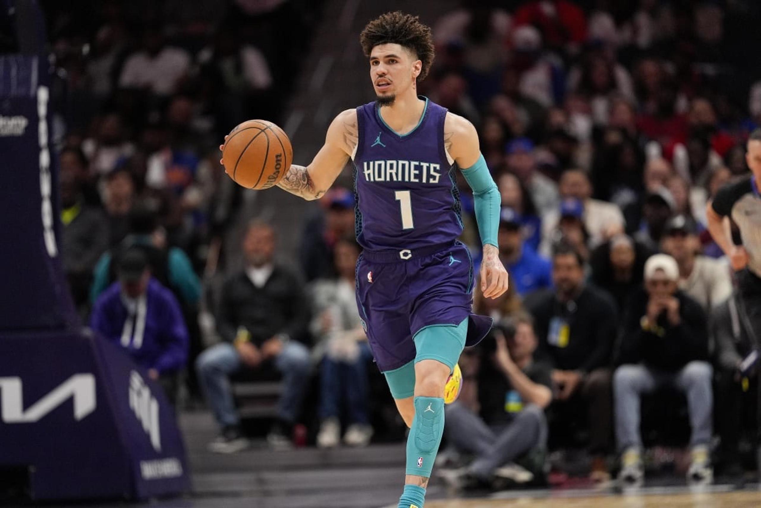 Mar 20, 2025; Charlotte, North Carolina, USA; Charlotte Hornets guard LaMelo Ball (1) brings the ball up court against the New York Knicks during the second half at Spectrum Center. Mandatory Credit: Jim Dedmon-Imagn Images
