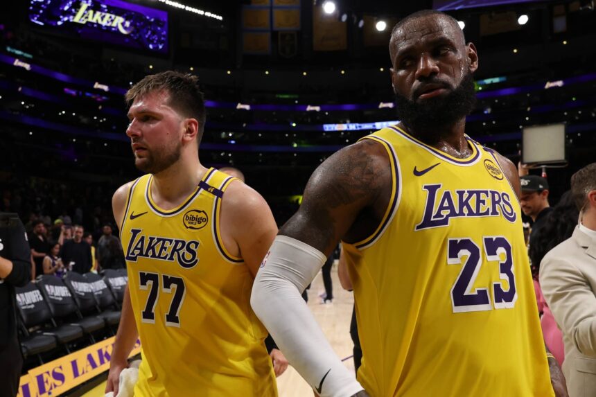 Los Angeles Lakers guard Luka Doncic (77) and Los Angeles Lakers forward LeBron James (23) leave a court after defeating the Minnesota Timberwolves 94-85 in game two of first round for the 2024 NBA Playoffs at Crypto.com Arena.