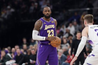 Los Angeles Lakers forward Lebron James (23) holds the ball during the second quarter against the Utah Jazz at Delta Center.