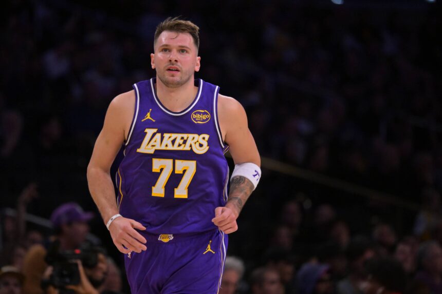 Los Angeles Lakers guard Luka Doncic (77) runs down court after a 3-point basket during the first half against the San Antonio Spurs at Crypto.com Arena.