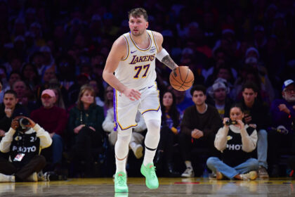 Los Angeles, California, USA; Los Angeles Lakers guard Luka Doncic (77) moves the ball against the Houston Rockets during the first half at Crypto.com Arena. Mandatory Credit: Gary A. Vasquez-Imagn Images