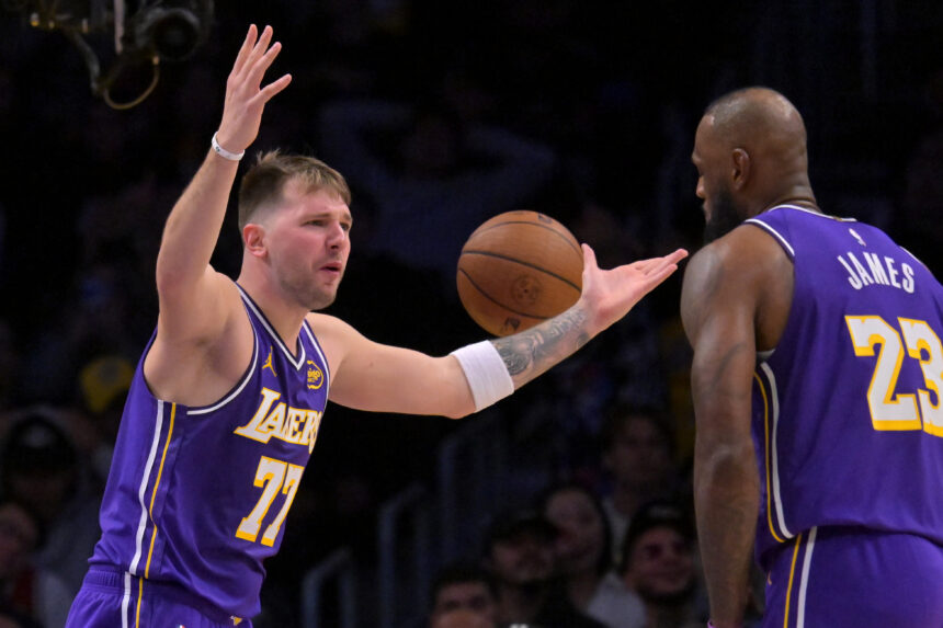 Dec 10, 2025; Los Angeles, California, USA; Los Angeles Lakers guard Luka Doncic (77) and forward Lebron James (23) react after a foul call during the second half against the San Antonio Spurs at Crypto.com Arena. Mandatory Credit: Jayne Kamin-Oncea-Imagn Images