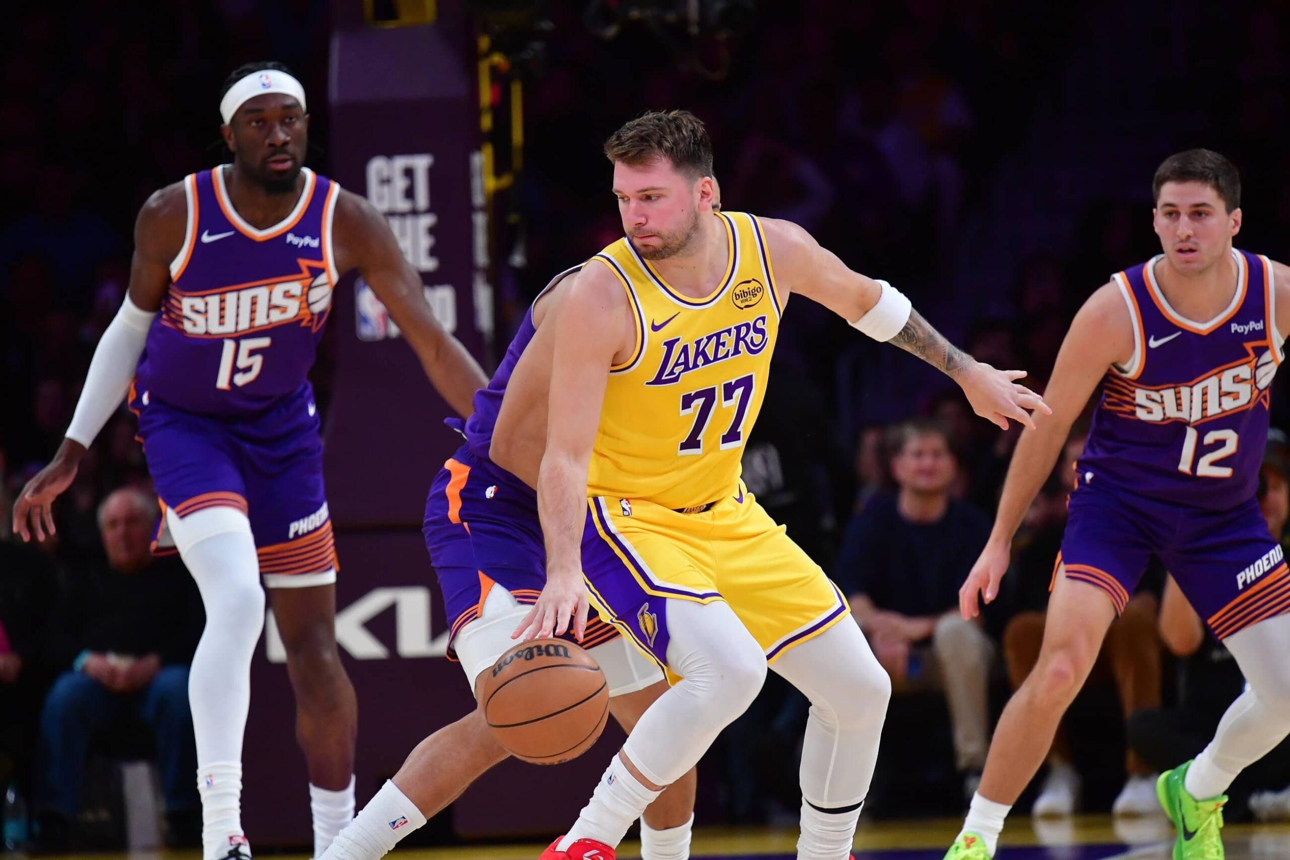 Los Angeles Lakers guard Luka Doncic (77) controls the ball against the Phoenix Suns during the first half at Crypto.com Arena.