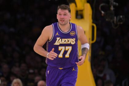 Los Angeles Lakers guard Luka Doncic (77) reacts after he was poked in the eye during the first half against the San Antonio Spurs at Crypto.com Arena. Mandatory Credit: Jayne Kamin-Oncea-Imagn Images