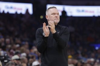 Denver Nuggets head coach Michael Malone watches his team play against the Oklahoma City Thunder during the first quarter at Paycom Center.