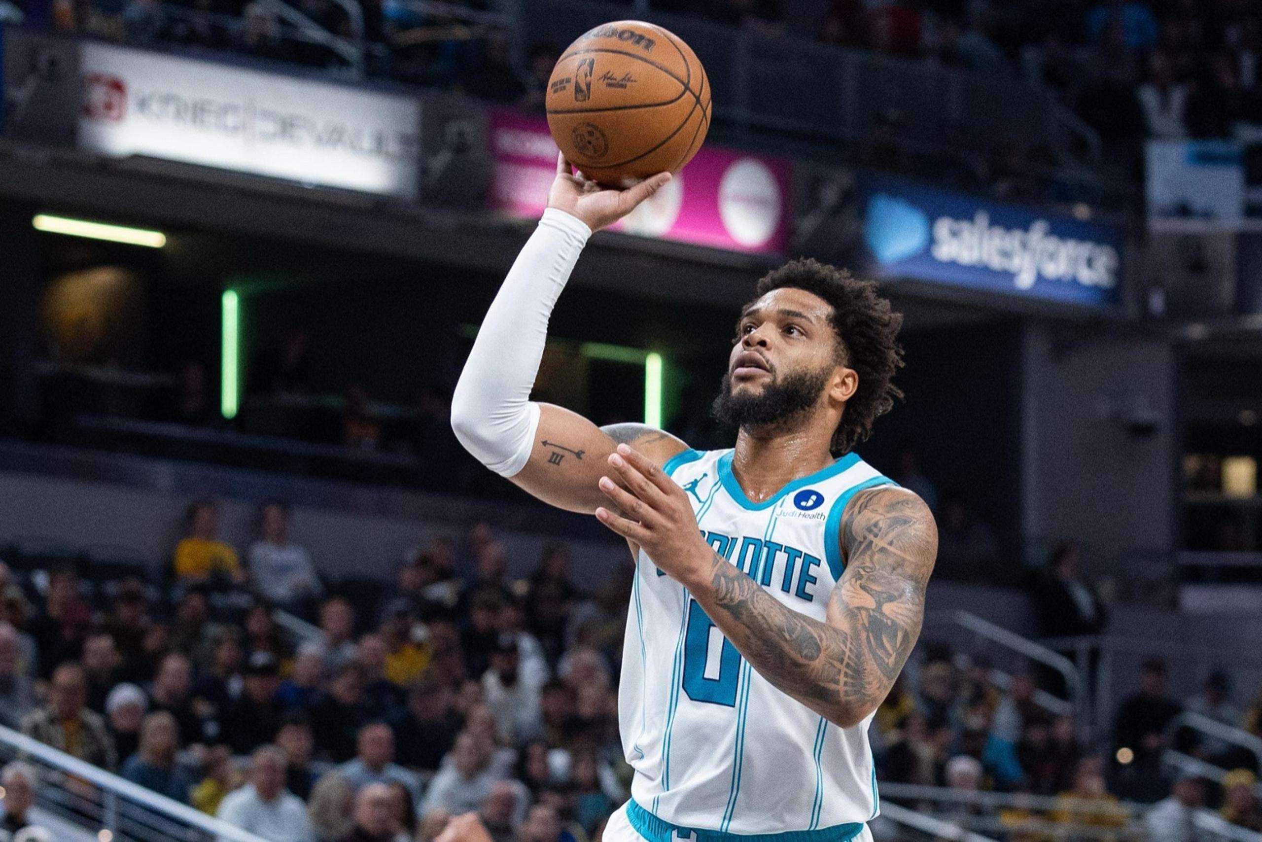 Nov 19, 2025; Indianapolis, Indiana, USA; Charlotte Hornets forward Miles Bridges (0) shoots the ball in the first half against the Indiana Pacers at Gainbridge Fieldhouse. Mandatory Credit: Trevor Ruszkowski-Imagn Images