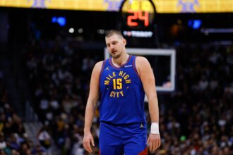 Denver Nuggets center Nikola Jokic (15) reacts in the fourth quarter against the Dallas Mavericks at Ball Arena.