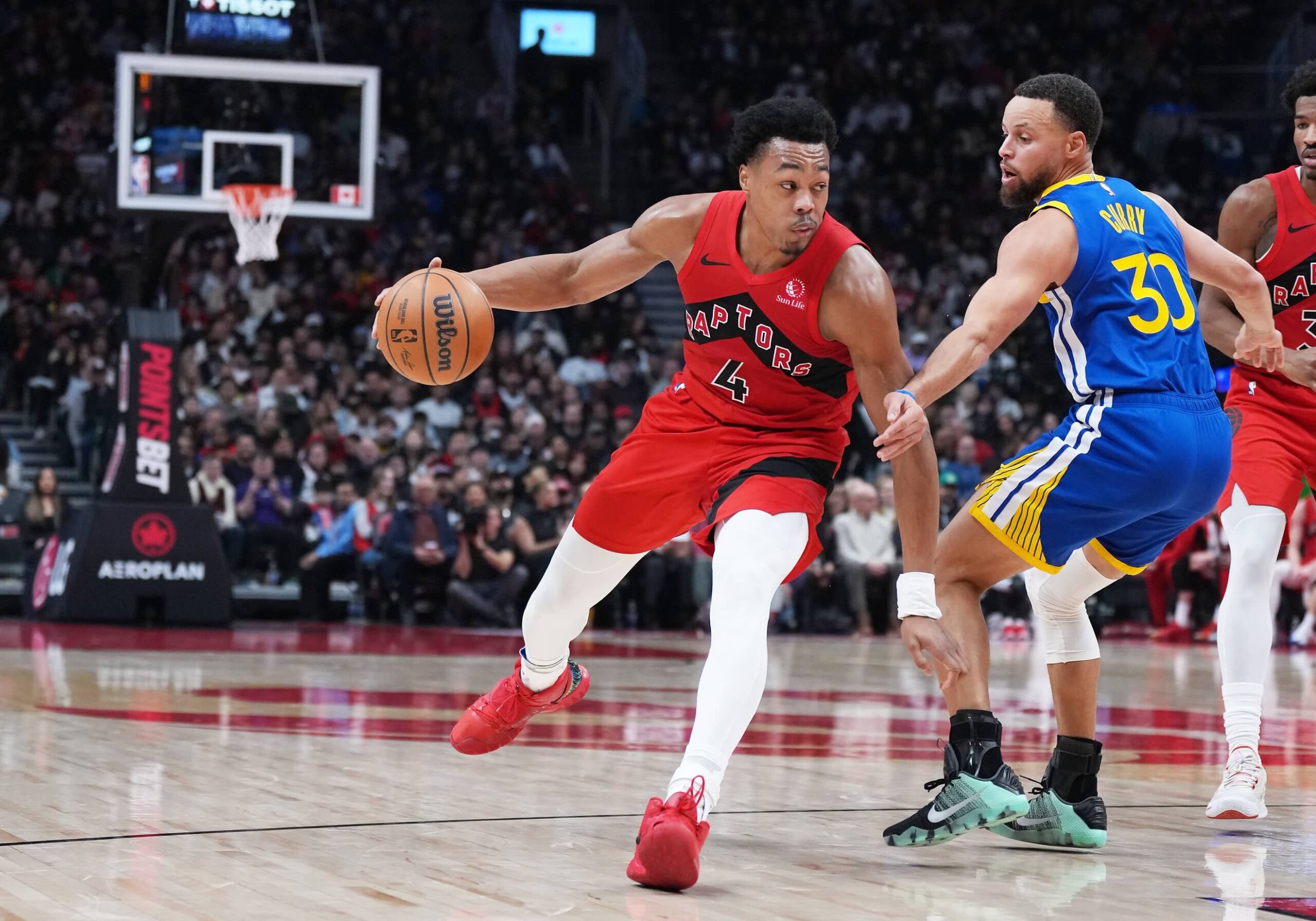Dec 28, 2025; Toronto, Ontario, CAN; Toronto Raptors forward Scottie Barnes (4) controls the ball as Golden State Warriors guard Stephen Curry (30) tries to defend during the second quarter at Scotiabank Arena. Mandatory Credit: Nick Turchiaro-Imagn Images