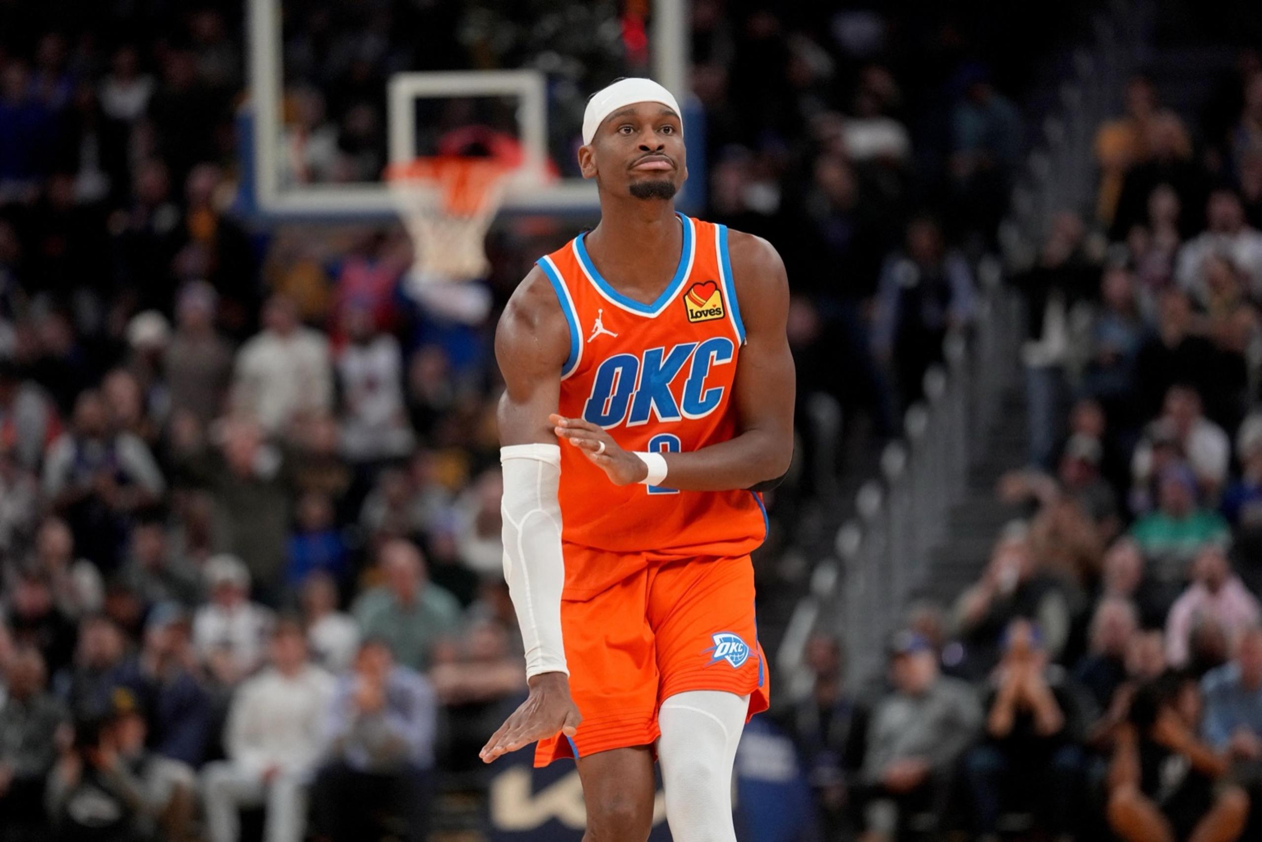 San Francisco, California, USA; Oklahoma City Thunder guard Shai Gilgeous-Alexander (2) reacts after making a basket against the Golden State Warriors in the fourth quarter at the Chase Center. Mandatory Credit: Cary Edmondson-Imagn Images