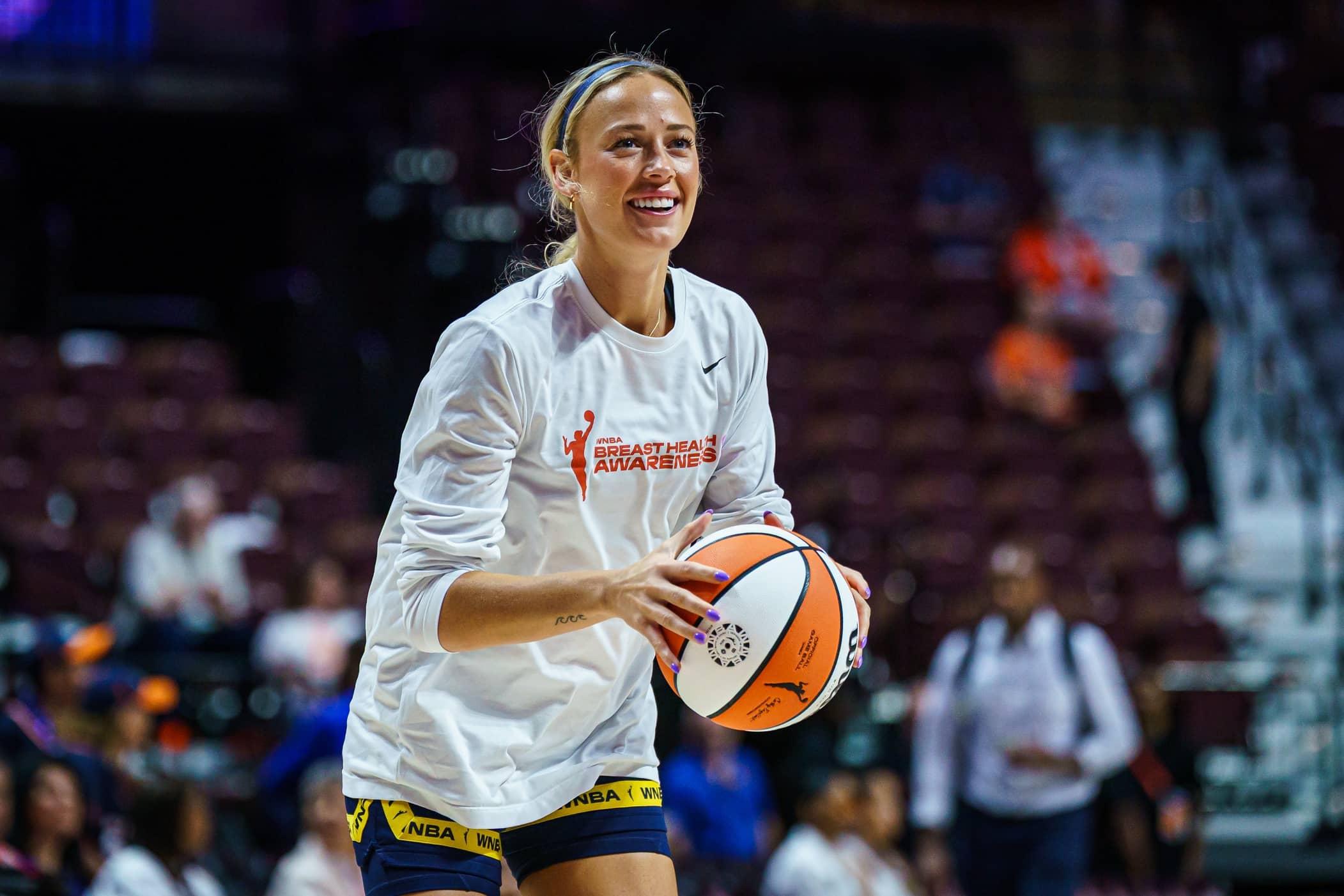 Indiana Fever guard Sophie Cunningham (8) warms up before the start of the game against the Connecticut Sun at Mohegan Sun Arena.
