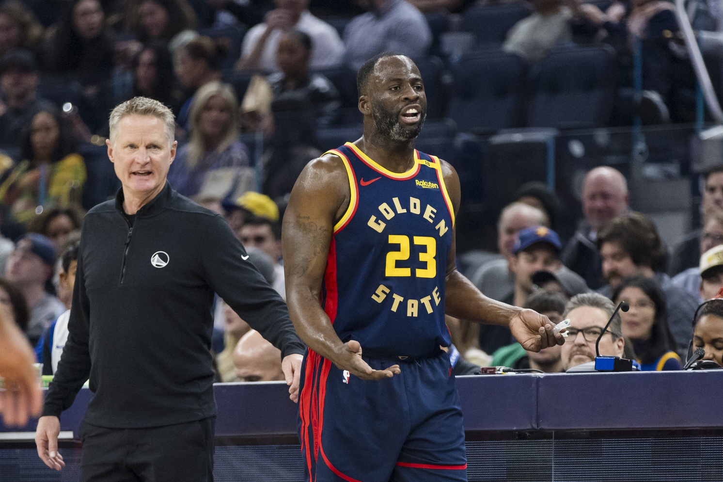 Jan 7, 2025; San Francisco, California, USA; Golden State Warriors forward Draymond Green (23) and head coach Steve Kerr react during the first quarter against the Miami Heat at Chase Center. Mandatory Credit: John Hefti-Imagn Images