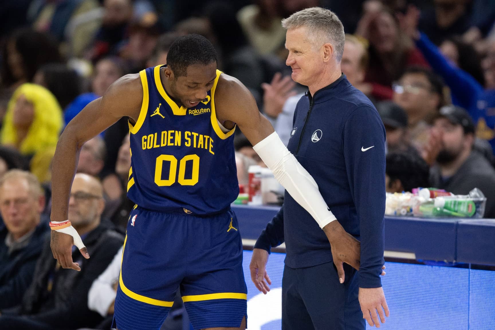 Jan 25, 2024; San Francisco, California, USA; Golden State Warriors forward Jonathan Kuminga (00) reacts after a foul with head coach Steve Kerr against the Sacramento Kings during the second quarter at Chase Center. Mandatory Credit: D. Ross Cameron-Imagn Images