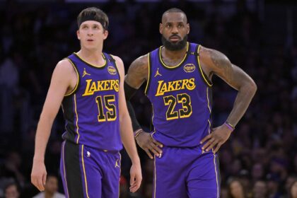 Jan 17, 2025; Los Angeles, California, USA; Los Angeles Lakers guard Austin Reaves (15) and forward LeBron James (23) talk on the court against the Brooklyn Nets at Crypto.com Arena. Mandatory Credit: Jayne Kamin-Oncea-Imagn Images