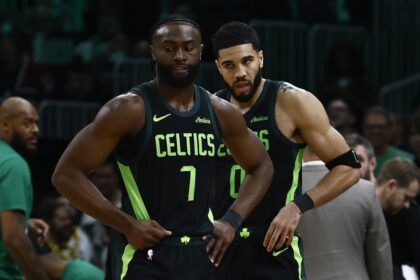 Boston, Massachusetts, USA; Boston Celtics guard Jaylen Brown (7) and forward Jayson Tatum (0) stand on the court during a timeout during the second half of their loss to the Cleveland Cavaliers at TD Garden. Mandatory Credit: Winslow Townson-Imagn Images