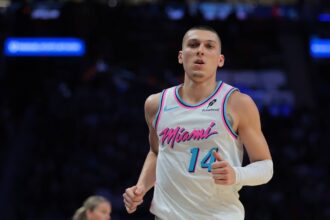Miami, Florida, USA; Miami Heat guard Tyler Herro (14) looks on against the Golden State Warriors during the third quarter at Kaseya Center. Mandatory Credit: Sam Navarro-Imagn Images
