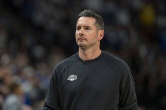 Minneapolis, Minnesota, USA; Los Angeles Lakers head coach JJ Redick looks on against the Minnesota Timberwolves in the first half during game three of first round for the 2024 NBA Playoffs at Target Center. Mandatory Credit: Jesse Johnson-Imagn Images