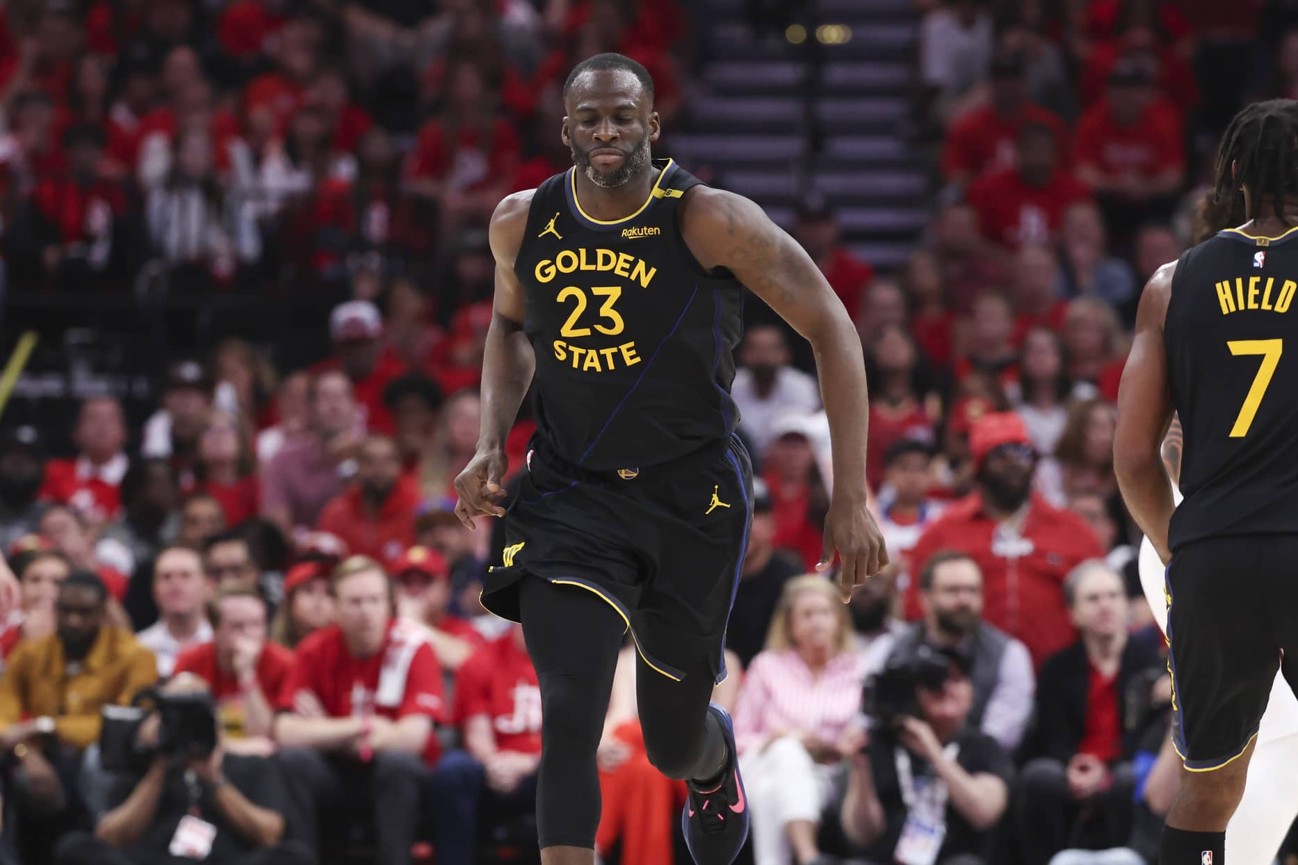 May 4, 2025; Houston, Texas, USA; Golden State Warriors forward Draymond Green (23) reacts after scoring a basket during the third quarter of game seven of the first round for the 2025 NBA Playoffs against the Houston Rockets at Toyota Center. Mandatory Credit: Troy Taormina-Imagn Images