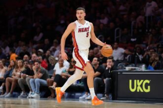 Oct 6, 2025; Miami, Florida, USA; Miami Heat forward Nikola Jovic (5) dribbles the basketball against the Milwaukee Bucks during the second quarter at Kaseya Center. Mandatory Credit: Sam Navarro-Imagn Images
