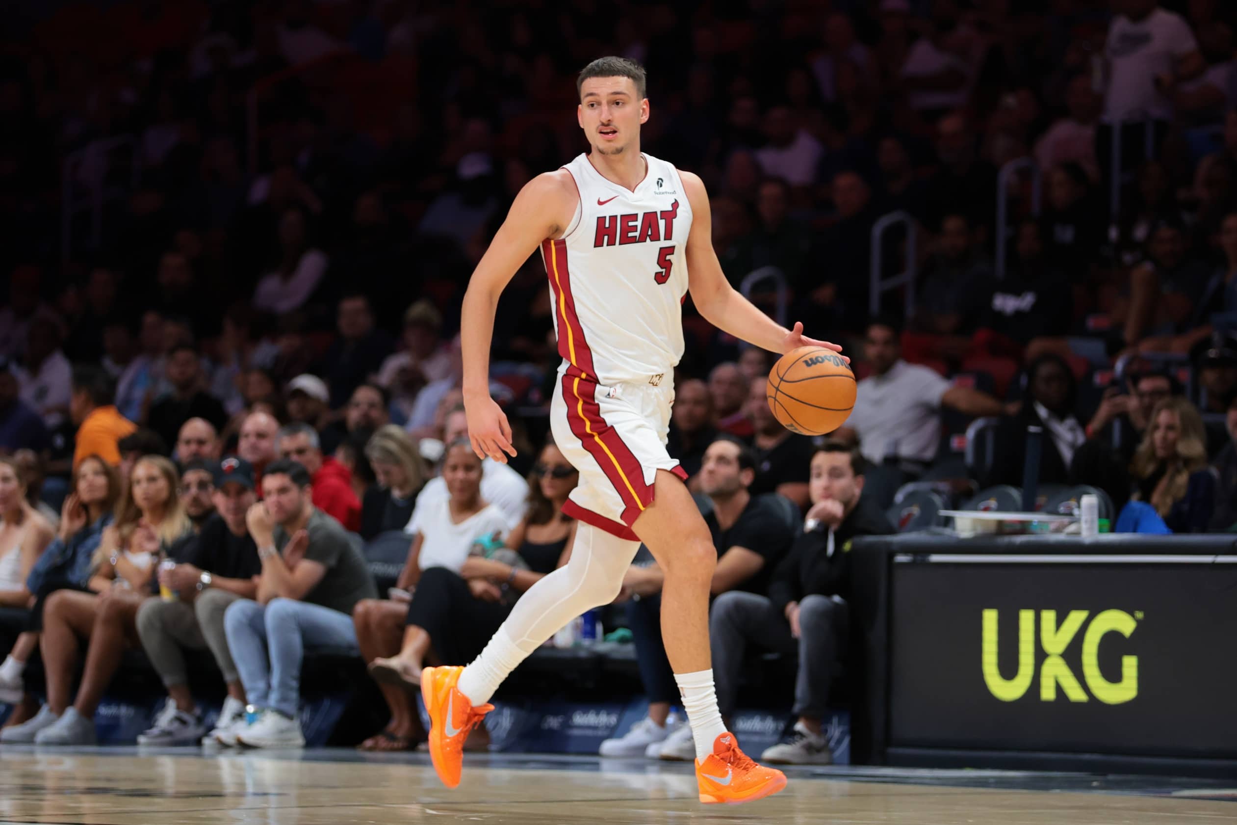 Oct 6, 2025; Miami, Florida, USA; Miami Heat forward Nikola Jovic (5) dribbles the basketball against the Milwaukee Bucks during the second quarter at Kaseya Center. Mandatory Credit: Sam Navarro-Imagn Images