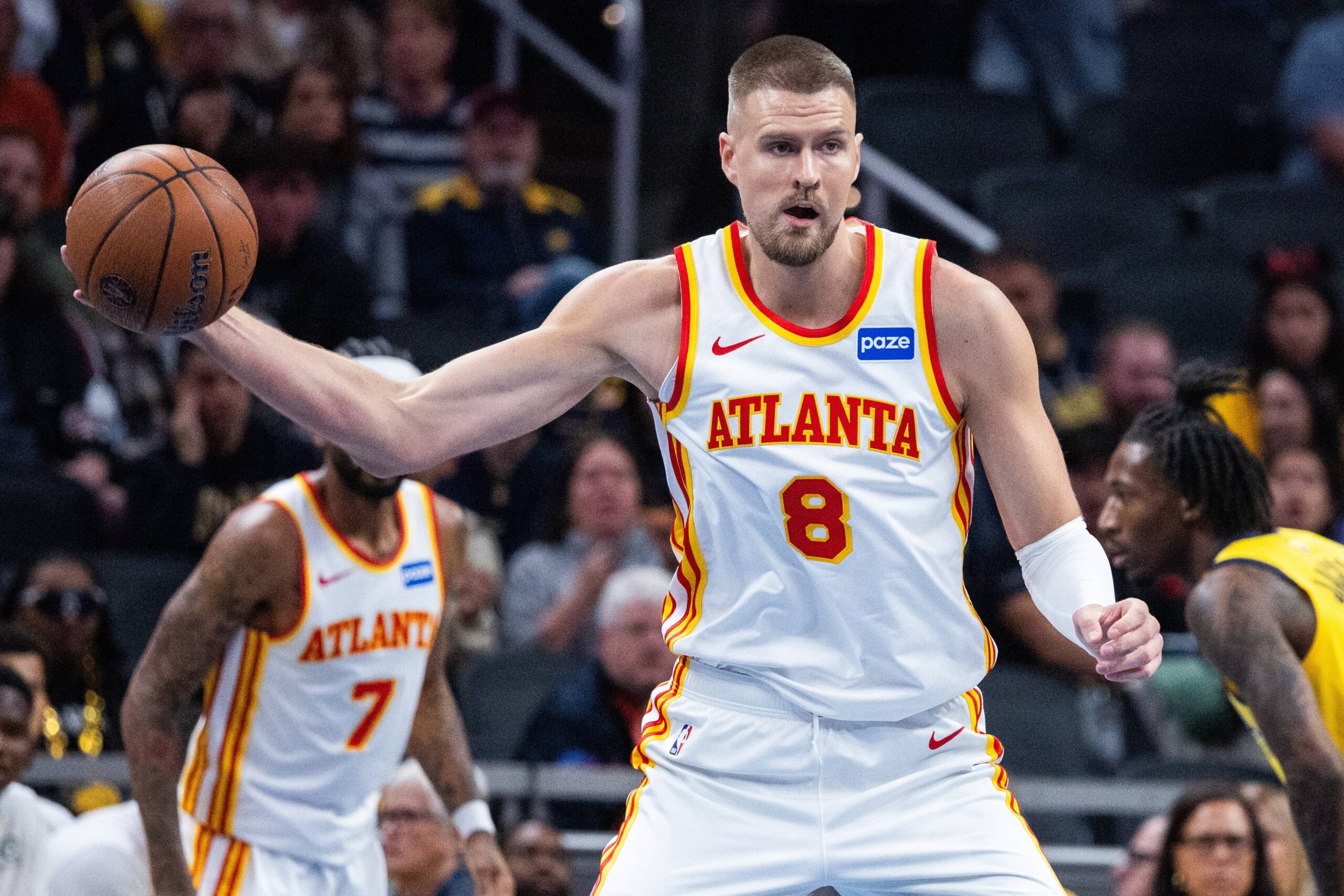 Oct 31, 2025; Indianapolis, Indiana, USA; Atlanta Hawks center Kristaps Porzingis (8) holds the ball while Indiana Pacers forward Isaiah Jackson (22) defends in the first half at Gainbridge Fieldhouse. Mandatory Credit: Trevor Ruszkowski-Imagn Images