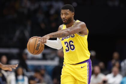 Charlotte, North Carolina, USA; Los Angeles Lakers guard Marcus Smart (36) directs the offense during the second quarter against the Charlotte Hornets at Spectrum Center. Mandatory Credit: Brian Westerholt-Imagn Images