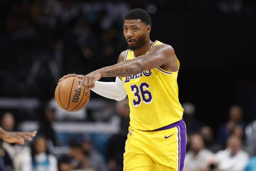 Charlotte, North Carolina, USA; Los Angeles Lakers guard Marcus Smart (36) directs the offense during the second quarter against the Charlotte Hornets at Spectrum Center. Mandatory Credit: Brian Westerholt-Imagn Images