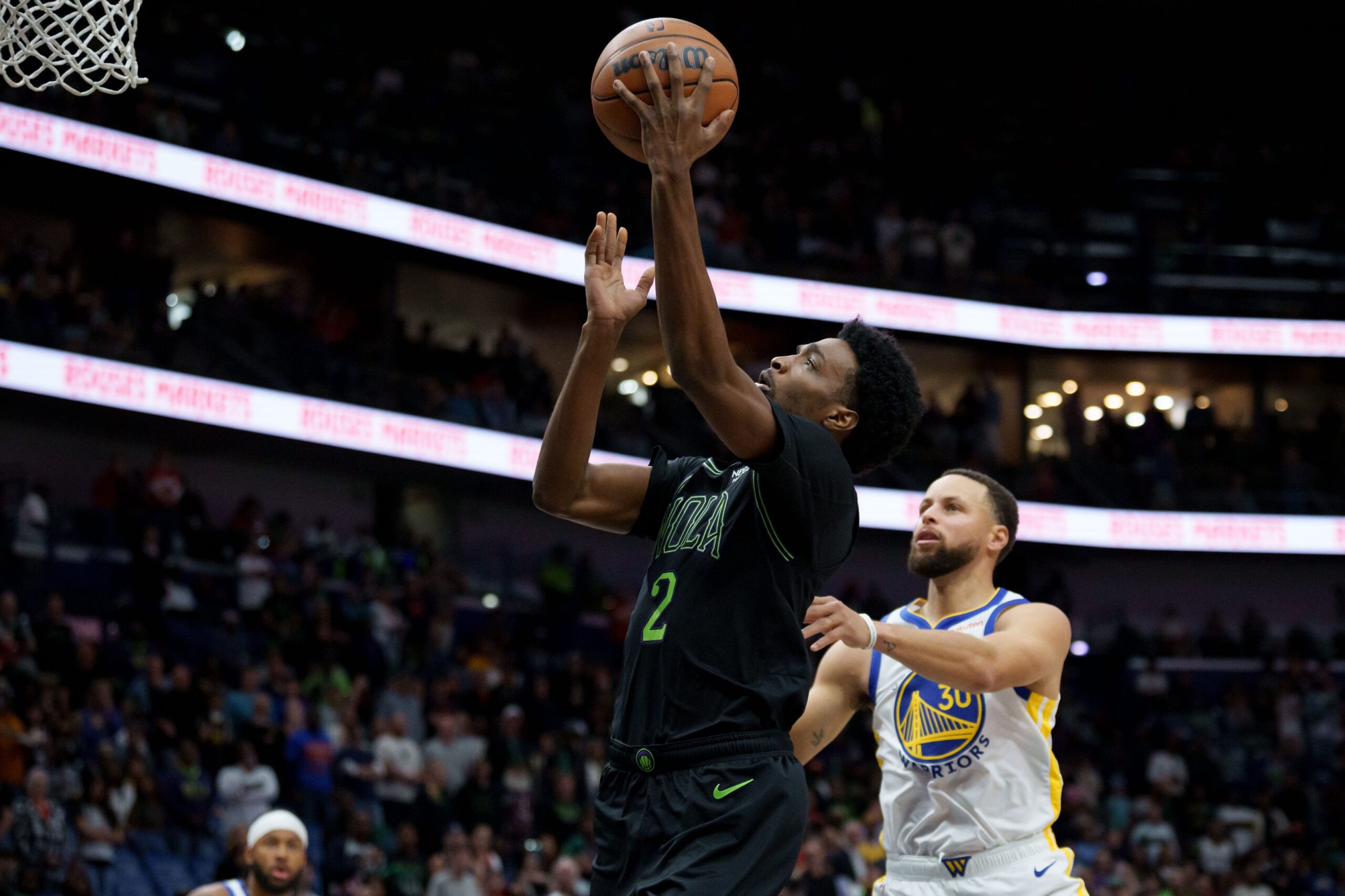 Nov 16, 2025; New Orleans, Louisiana, USA; New Orleans Pelicans forward Herbert Jones (2) shoots against Golden State Warriors guard Stephen Curry (30) during the first half at Smoothie King Center. Mandatory Credit: Matthew Hinton-Imagn Images
