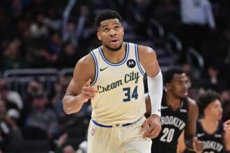Nov 29, 2025; Milwaukee, Wisconsin, USA; Milwaukee Bucks forward Giannis Antetokounmpo (34) reacts after scoring his 21,000th career point in the third quarter against the Brooklyn Nets at Fiserv Forum. Mandatory Credit: Benny Sieu-Imagn Images