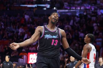 Miami, Florida, USA; Miami Heat center Bam Adebayo (13) reacts against the Detroit Pistons during the second half at Kaseya Center. Mandatory Credit: Rhona Wise-Imagn Images