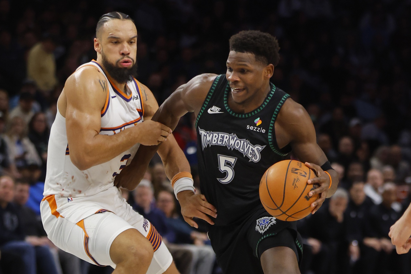 Dec 8, 2025; Minneapolis, Minnesota, USA; Minnesota Timberwolves guard Anthony Edwards (5) works around Phoenix Suns forward Dillon Brooks (3) in the third quarter at Target Center. Mandatory Credit: Bruce Kluckhohn-Imagn Images