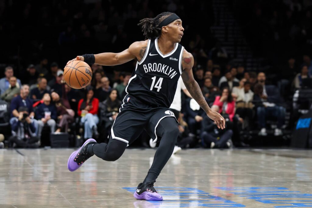 Dec 4, 2025; Brooklyn, New York, USA; Brooklyn Nets guard Terance Mann (14) dribbles the ball against the Utah Jazz during the first quarter at Barclays Center. Mandatory Credit: Tom Horak-Imagn Images