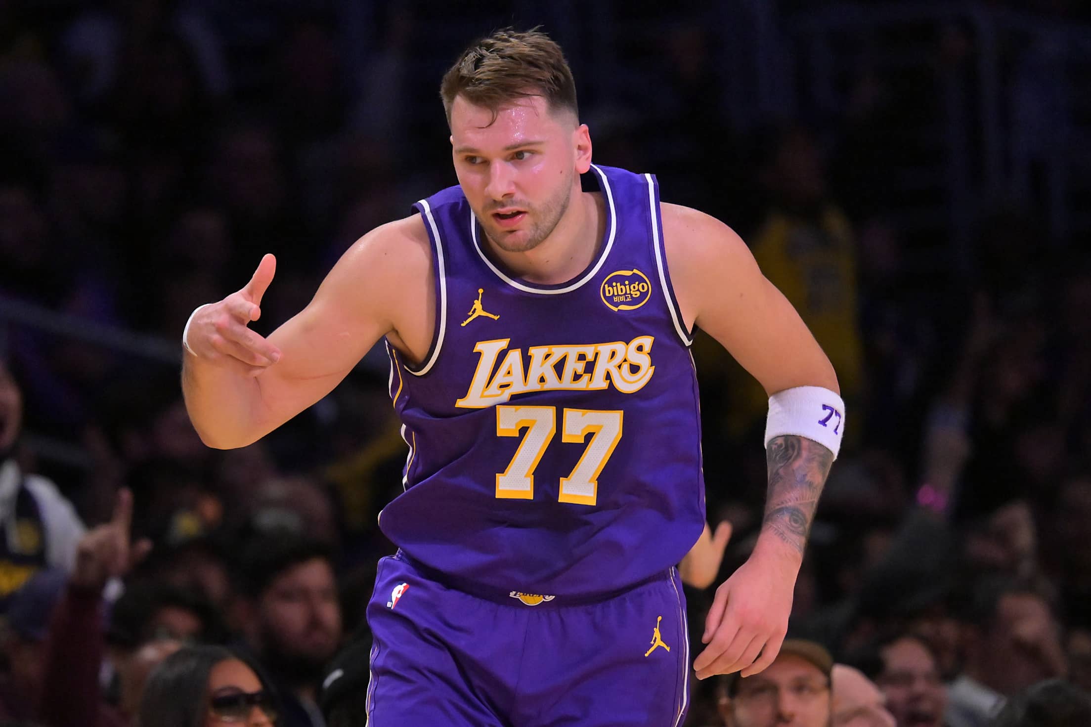 Dec 10, 2025; Los Angeles, California, USA; Los Angeles Lakers guard Luka Doncic (77) reacts after a 3-point basket during the first half against the San Antonio Spurs at Crypto.com Arena. Mandatory Credit: Jayne Kamin-Oncea-Imagn Images