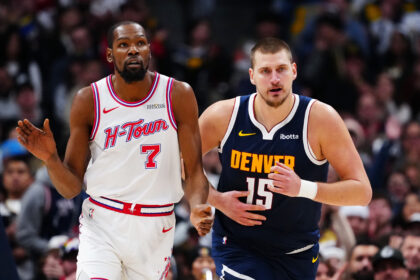 Dec 15, 2025; Denver, Colorado, USA; Houston Rockets forward Kevin Durant (7) and Denver Nuggets center Nikola Jokic (15) during the second quarter at Ball Arena. Mandatory Credit: Ron Chenoy-Imagn Images