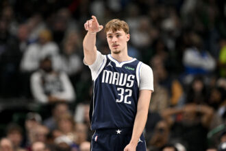 Dallas Mavericks forward Cooper Flagg (32) motions to his teammates during the second quarter against the Detroit Pistons at the American Airlines Center. Mandatory Credit: Jerome Miron-Imagn Images