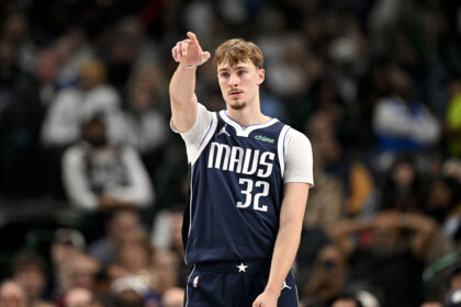 Dallas Mavericks forward Cooper Flagg (32) motions to his teammates during the second quarter against the Detroit Pistons at the American Airlines Center. Mandatory Credit: Jerome Miron-Imagn Images