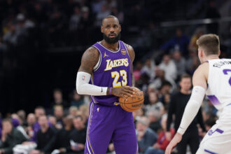 Salt Lake City, Utah, USA; Los Angeles Lakers forward Lebron James (23) holds the ball during the second quarter against the Utah Jazz at Delta Center. Mandatory Credit: Chris Nicoll-Imagn Images